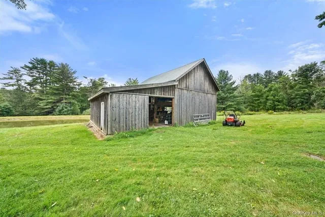 a view of a park with large trees