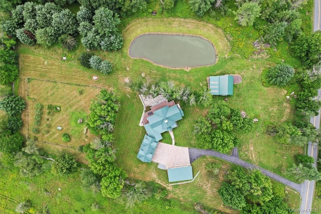 1038 Milanville Road Beach Lake, PA 18405 - Photo 33 of 36 an aerial view of residential house with outdoor space and swimming pool