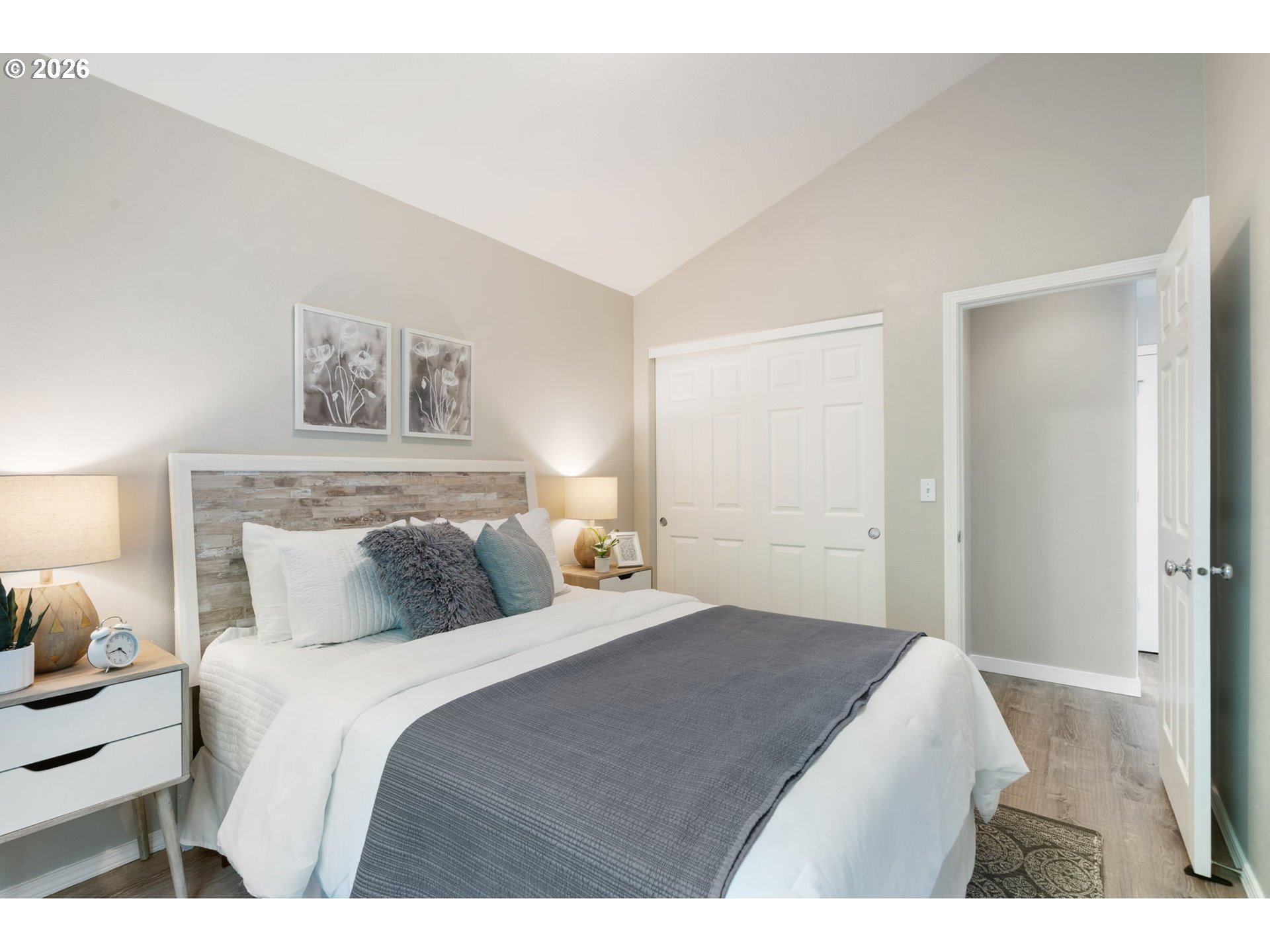 13159 Southwest Brianne Way Portland, OR 97223 - Photo 23 of 32 a bedroom with a bed and a night stand