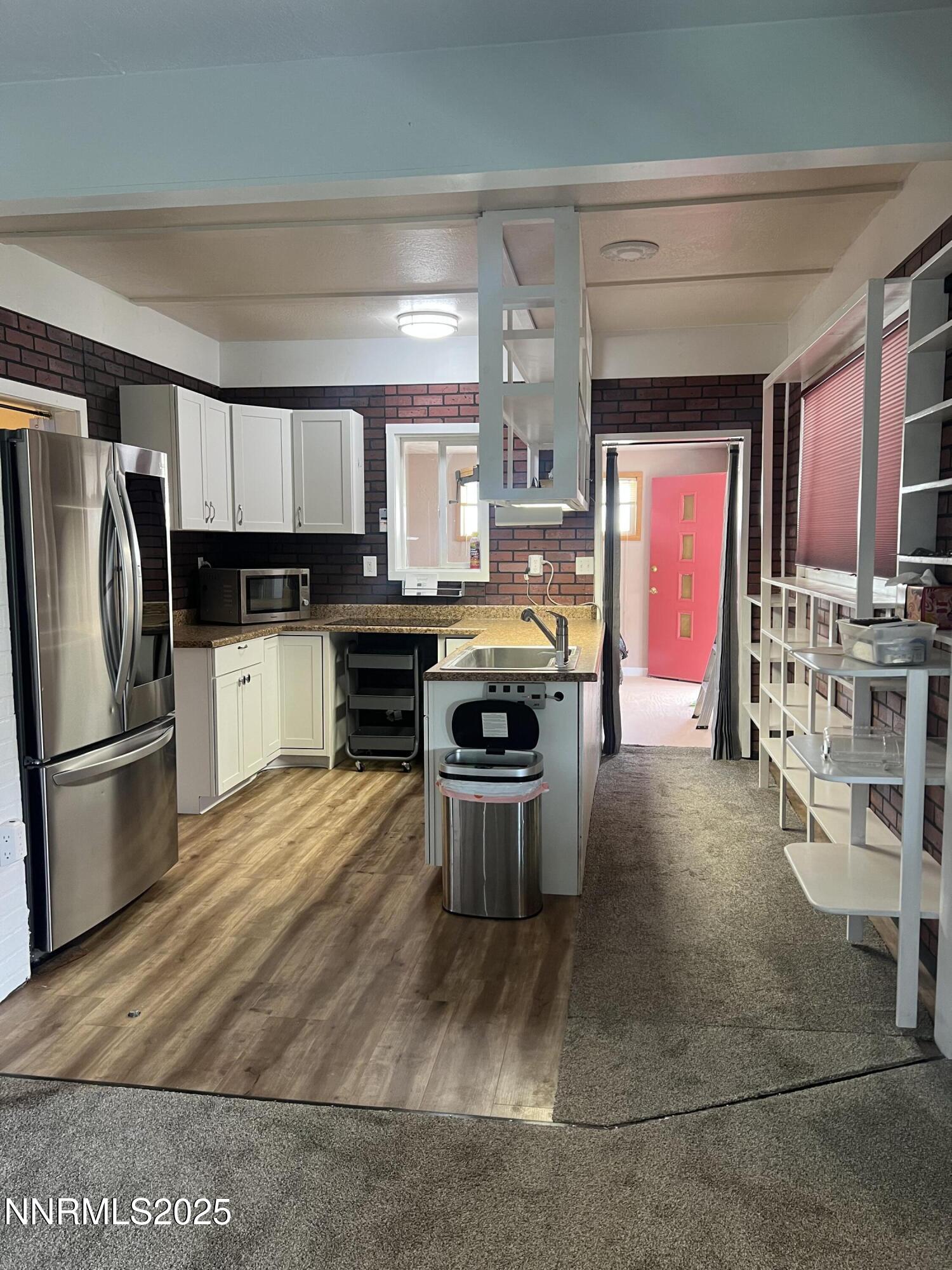 16 Tucker Lane Yerington, NV 89447 - Photo 4 of 12 a kitchen with stainless steel appliances a stove a sink dishwasher a refrigerator and a oven