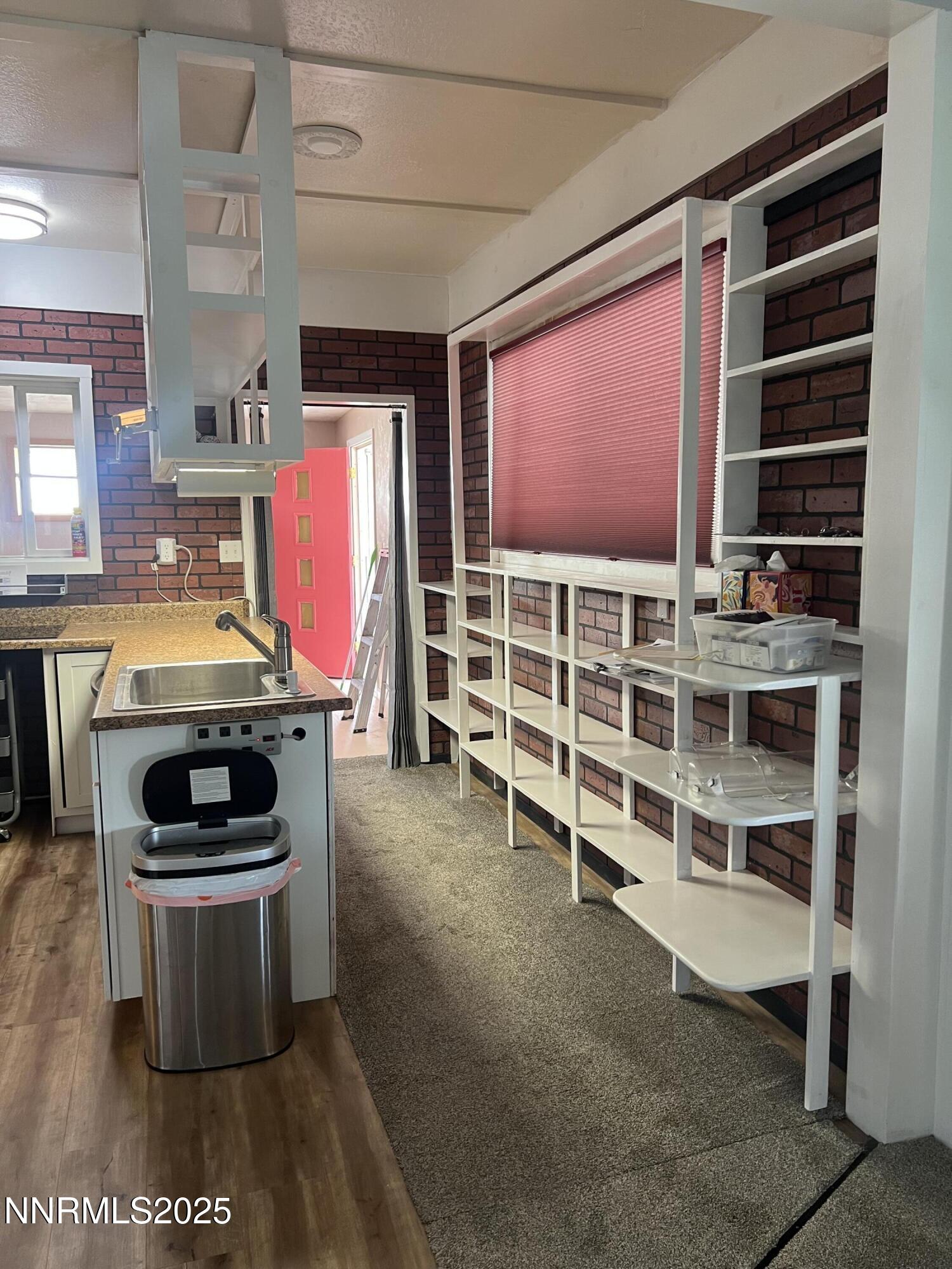 16 Tucker Lane Yerington, NV 89447 - Photo 5 of 12 a view of an empty room with furniture and window