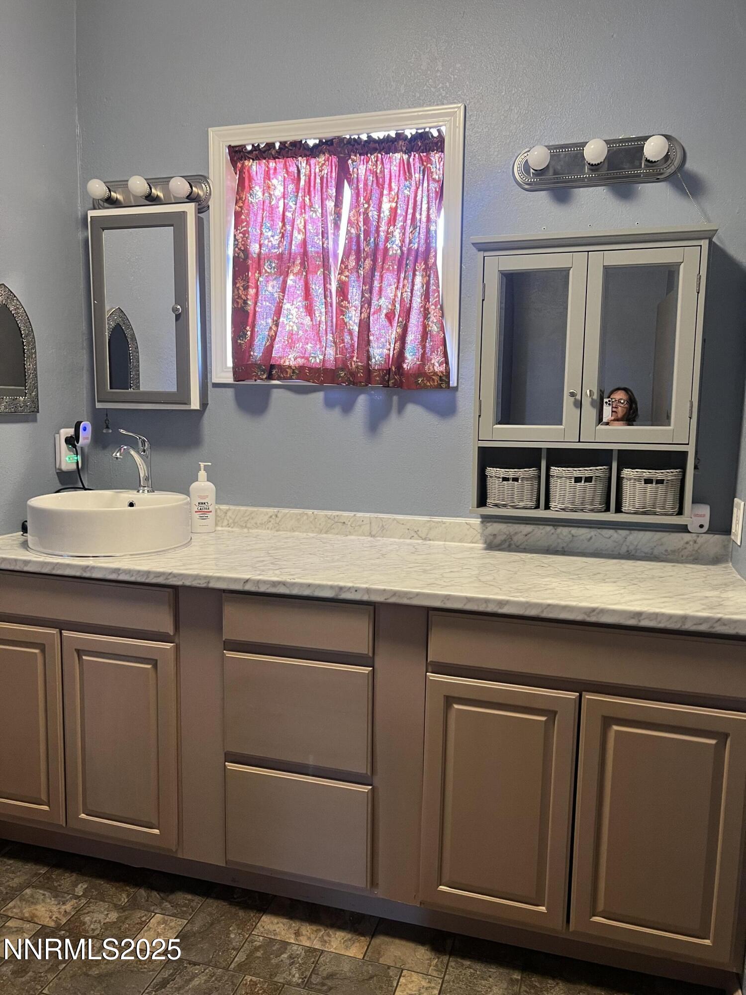 16 Tucker Lane Yerington, NV 89447 - Photo 7 of 12 a bathroom with a sink and a mirror