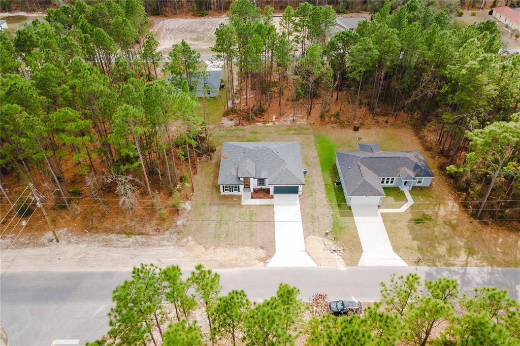 6732 Southwest 132nd Street Ocala, FL 34473 - Photo 31 of 36 an aerial view of a house with swimming pool