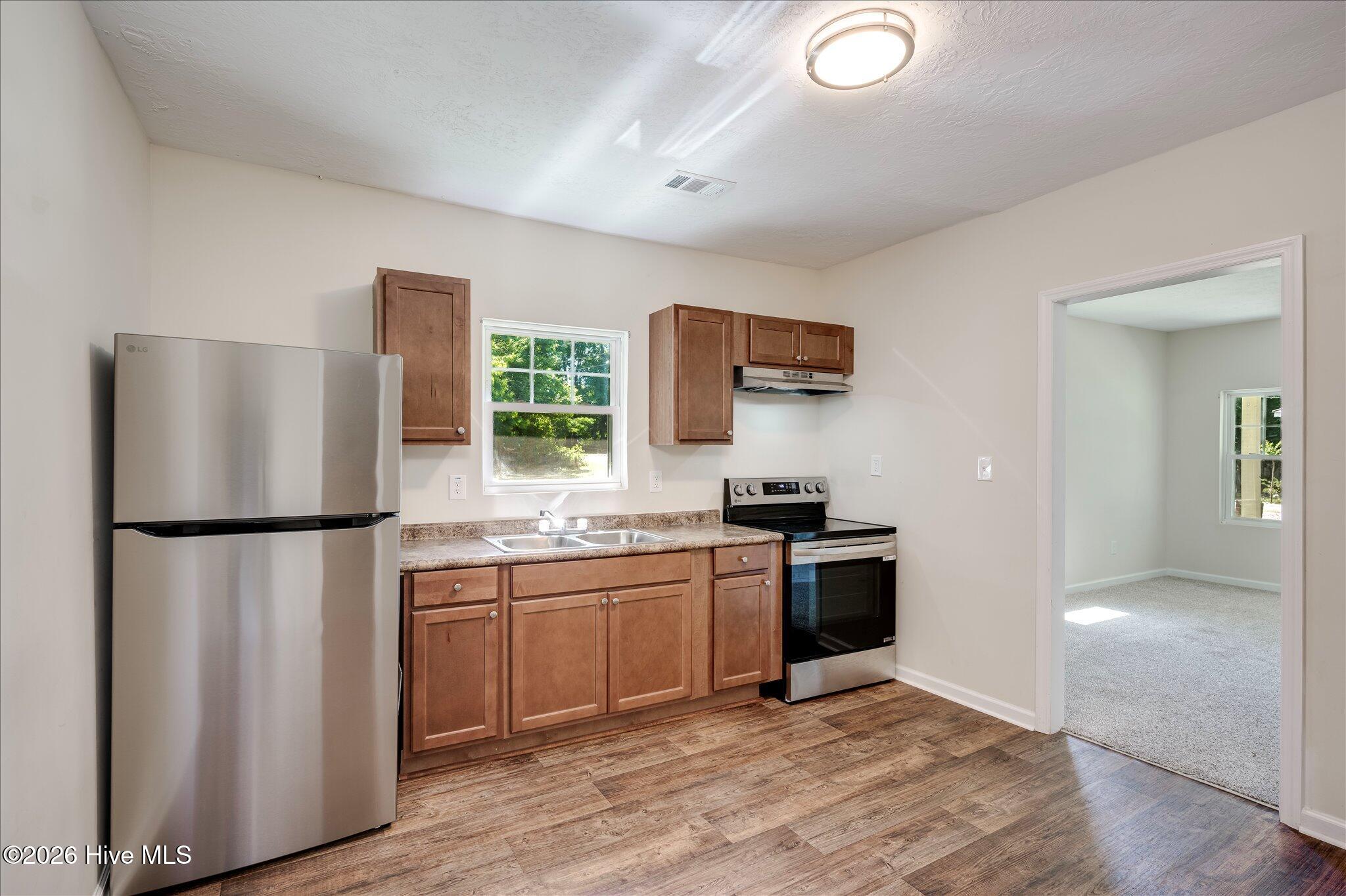 124 West Street Thomson, GA 30824 - Photo 11 of 28 Kitchen/Living Room