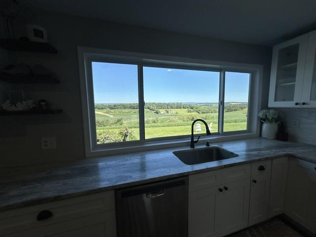 9191 Red Road Kempton, PA 19529 - Photo 14 of 25 Rolling green hills fill the expansive window framing this modern kitchen workspace.