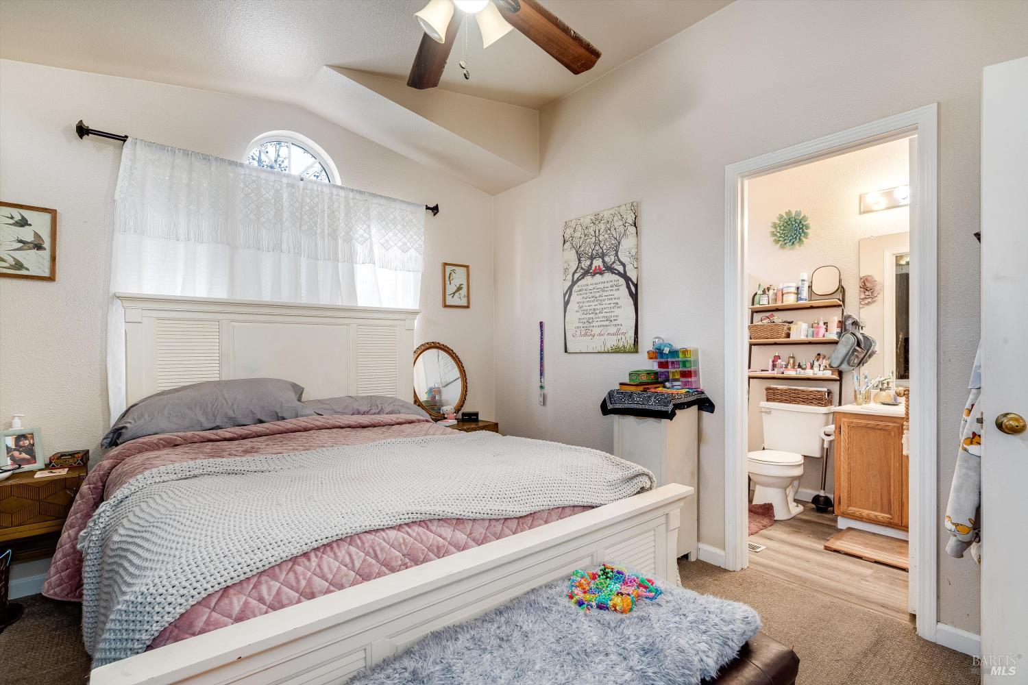 590 Laurel Grove Circle Santa Rosa, CA 95407 - Photo 19 of 44 a bedroom with a bed and cabinets
