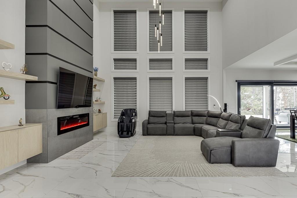 741 Rock Springs Road, Unit 3 Lawrenceville, GA 30043 - Photo 11 of 53 a living room with furniture a flat screen tv and a fireplace