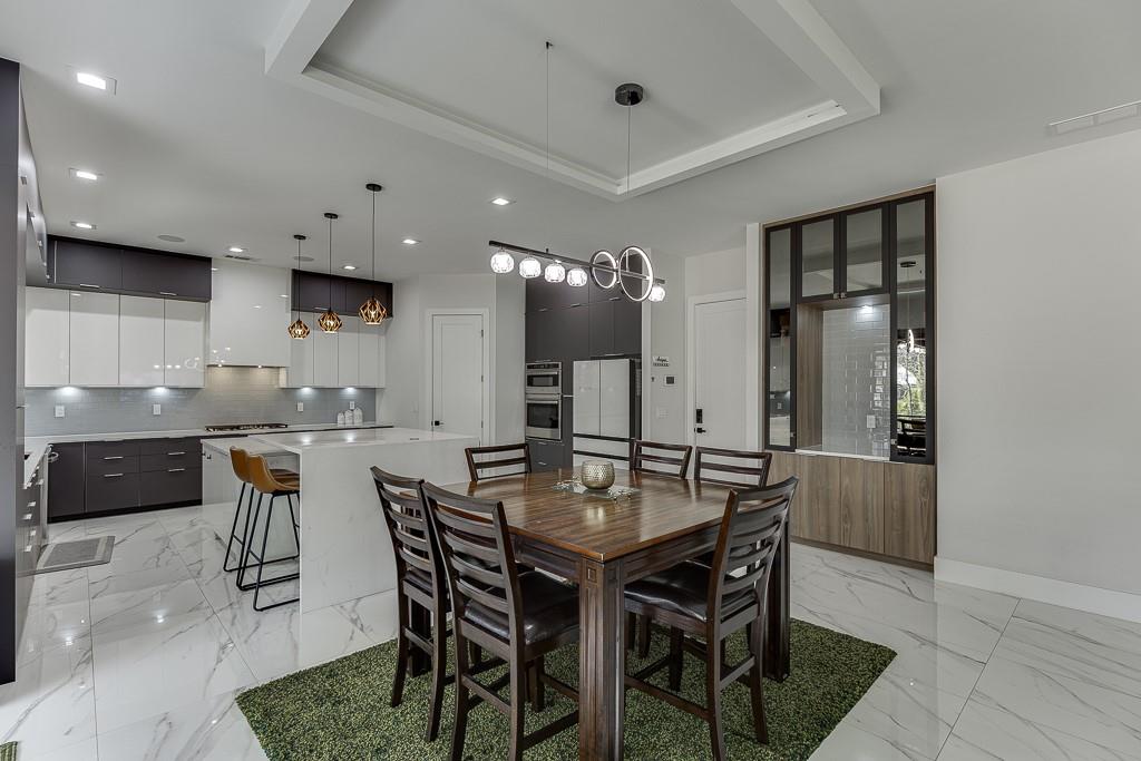 741 Rock Springs Road, Unit 3 Lawrenceville, GA 30043 - Photo 13 of 53 a kitchen with a table and chairs in it
