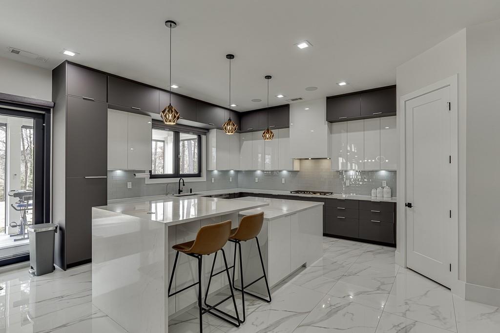 741 Rock Springs Road, Unit 3 Lawrenceville, GA 30043 - Photo 15 of 53 a kitchen with stainless steel appliances granite countertop a stove a sink and a refrigerator