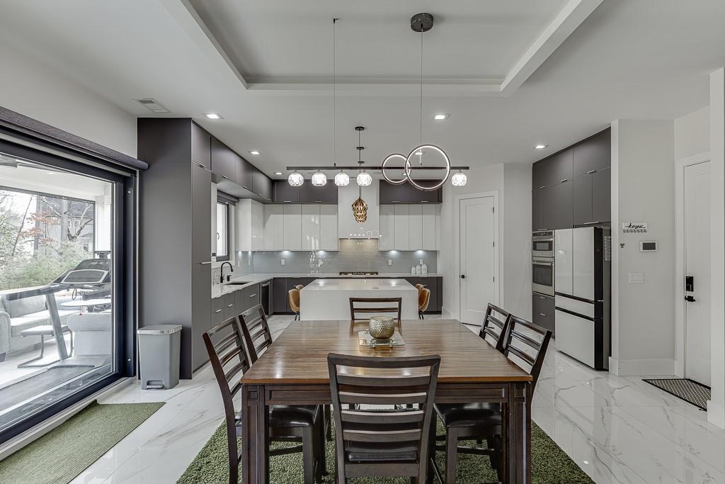 741 Rock Springs Road, Unit 3 Lawrenceville, GA 30043 - Photo 18 of 53 a view of a dining room with furniture and a floor to ceiling window
