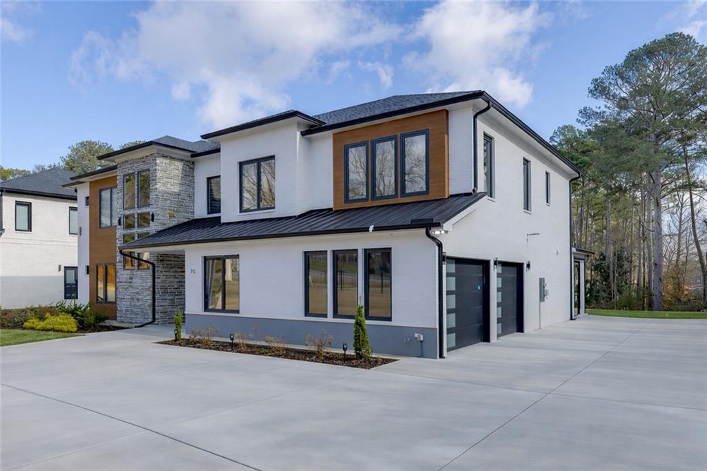 741 Rock Springs Road, Unit 3 Lawrenceville, GA 30043 - Photo 2 of 53 a front view of a house with a garage