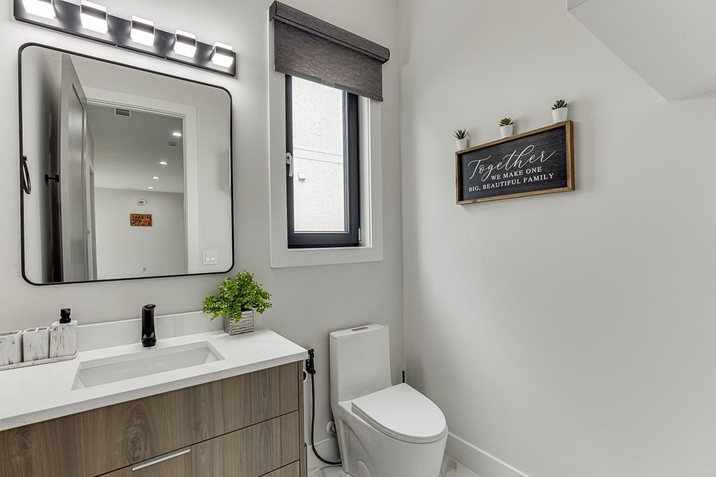 741 Rock Springs Road, Unit 3 Lawrenceville, GA 30043 - Photo 21 of 53 a bathroom with a toilet sink and mirror