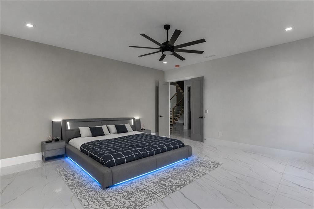 741 Rock Springs Road, Unit 3 Lawrenceville, GA 30043 - Photo 23 of 53 a bedroom with a bed rug and wall painting