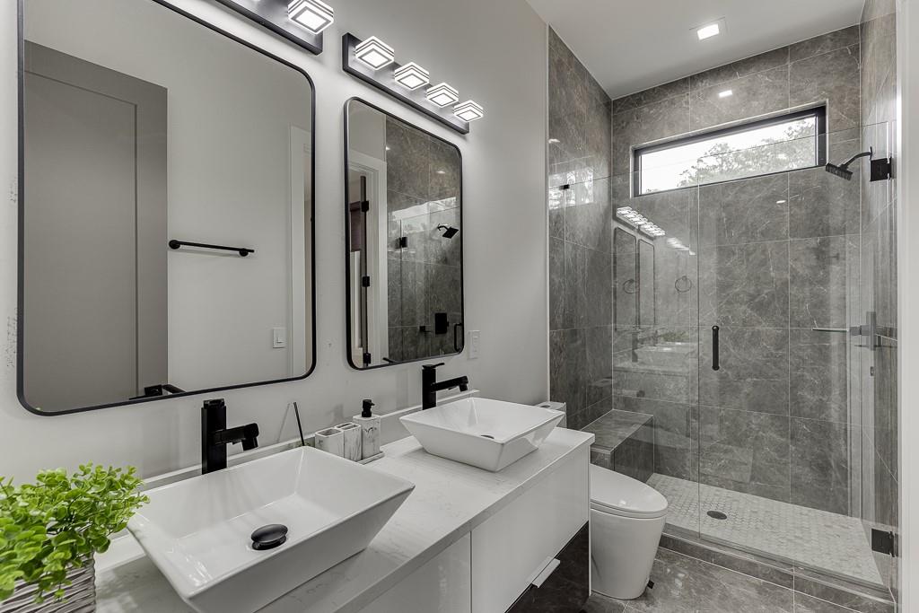 741 Rock Springs Road, Unit 3 Lawrenceville, GA 30043 - Photo 27 of 53 a bathroom with a sink toilet a mirror and shower
