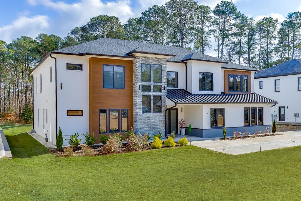 741 Rock Springs Road, Unit 3 Lawrenceville, GA 30043 - Photo 3 of 53 a front view of house with yard and green space