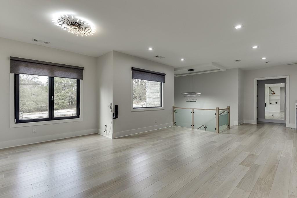 741 Rock Springs Road, Unit 3 Lawrenceville, GA 30043 - Photo 33 of 53 an empty room with wooden floor and windows