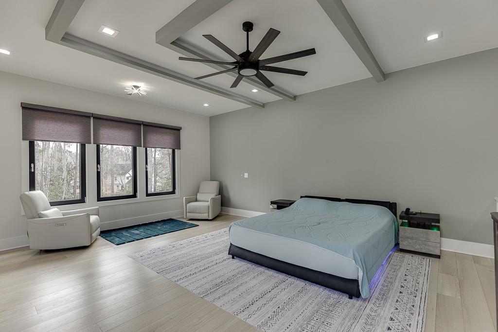 741 Rock Springs Road, Unit 3 Lawrenceville, GA 30043 - Photo 37 of 53 a bedroom with a bed couch and a large window