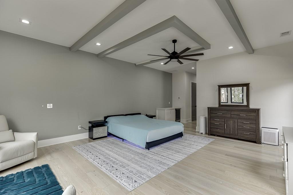 741 Rock Springs Road, Unit 3 Lawrenceville, GA 30043 - Photo 38 of 53 a bedroom with a large bed and a ceiling fan
