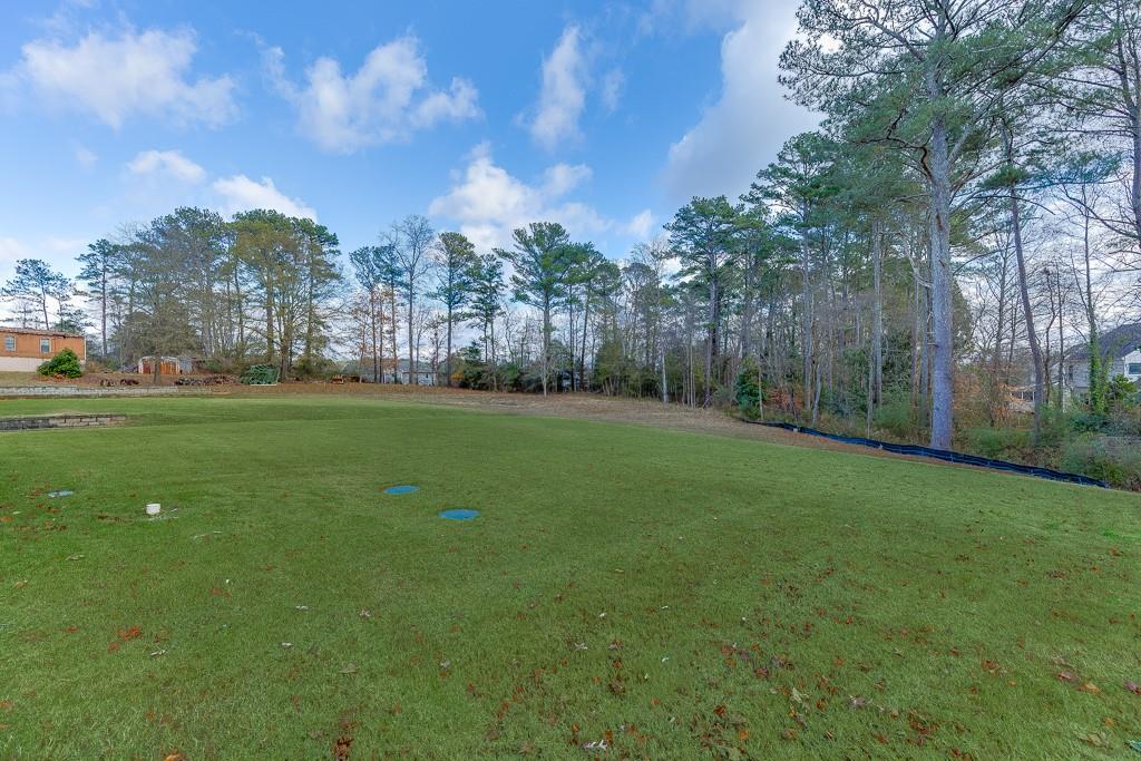 741 Rock Springs Road, Unit 3 Lawrenceville, GA 30043 - Photo 48 of 53 a view of a field of grass and trees