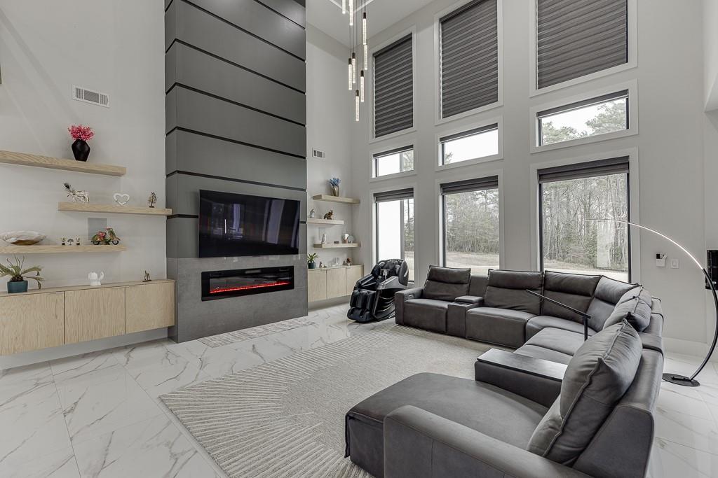 741 Rock Springs Road, Unit 3 Lawrenceville, GA 30043 - Photo 6 of 53 a living room with furniture and a flat screen tv