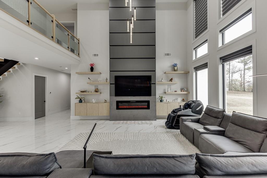 741 Rock Springs Road, Unit 3 Lawrenceville, GA 30043 - Photo 7 of 53 a living room with furniture a flat screen tv and a fireplace