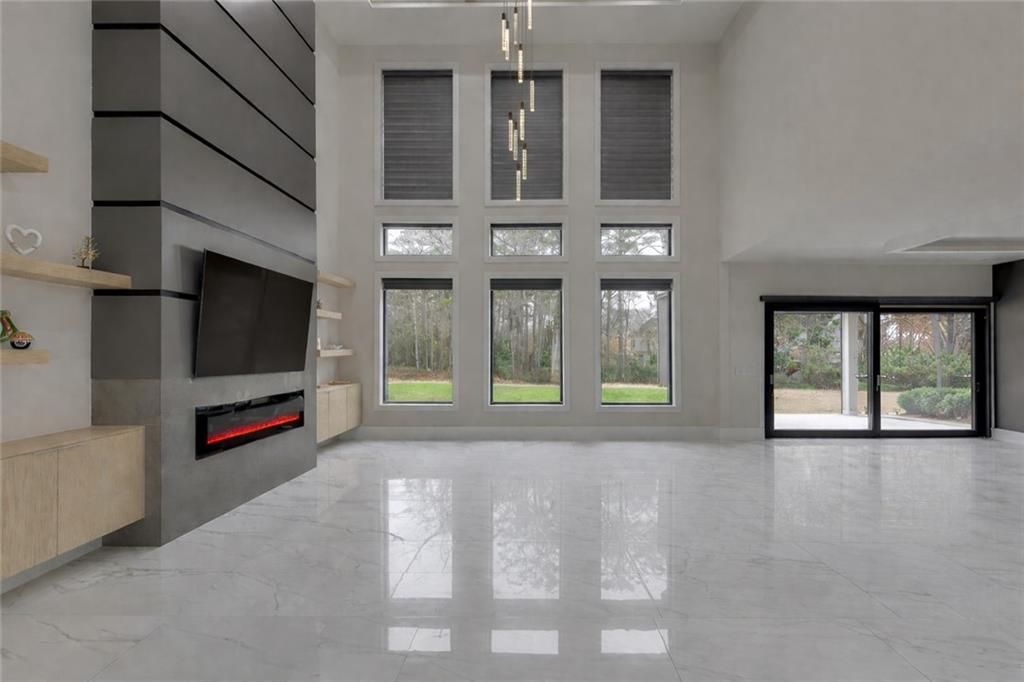 741 Rock Springs Road, Unit 3 Lawrenceville, GA 30043 - Photo 9 of 53 a living room with furniture large window and flat screen tv