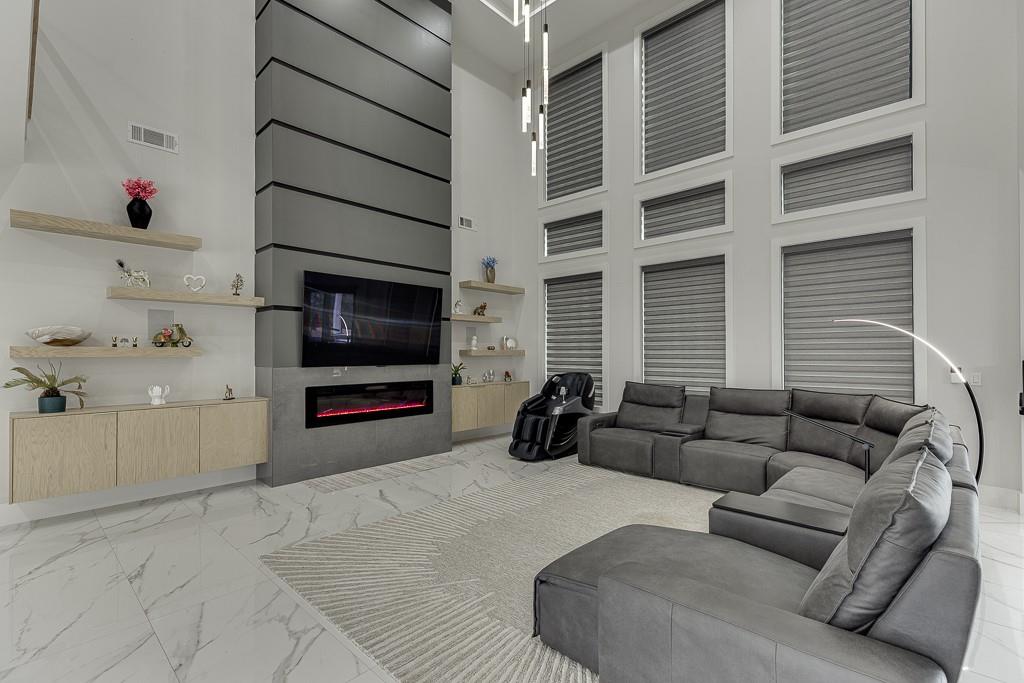 741 Rock Springs Road, Unit 3 Lawrenceville, GA 30043 - Photo 10 of 53 a living room with furniture and a flat screen tv