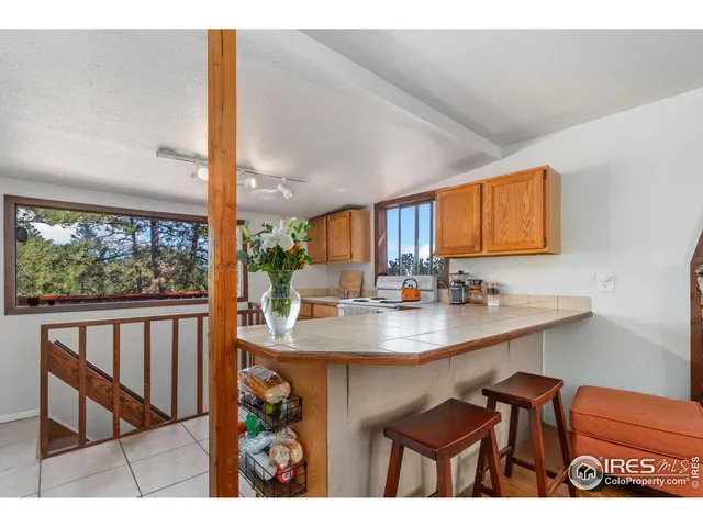 a view of a dining room with furniture and window