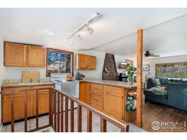 a kitchen view with stainless steel appliances granite countertop a sink and cabinets