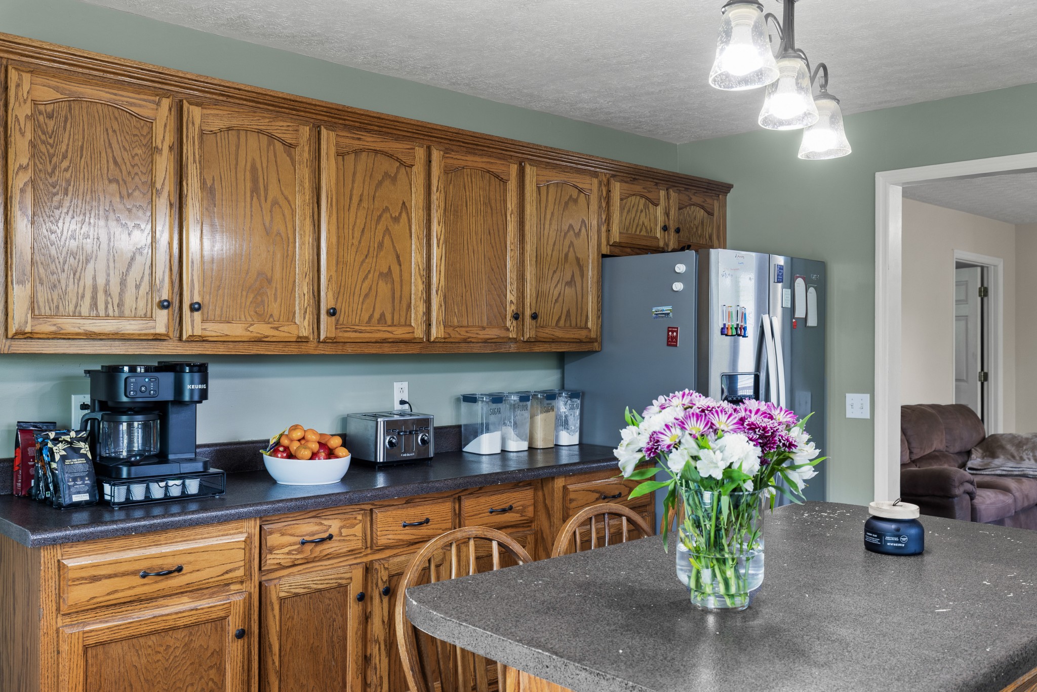 2490 Clampit Hollow Road Lafayette, TN 37083 - Photo 20 of 55 a kitchen with stainless steel appliances granite countertop sink cabinets and wooden floor