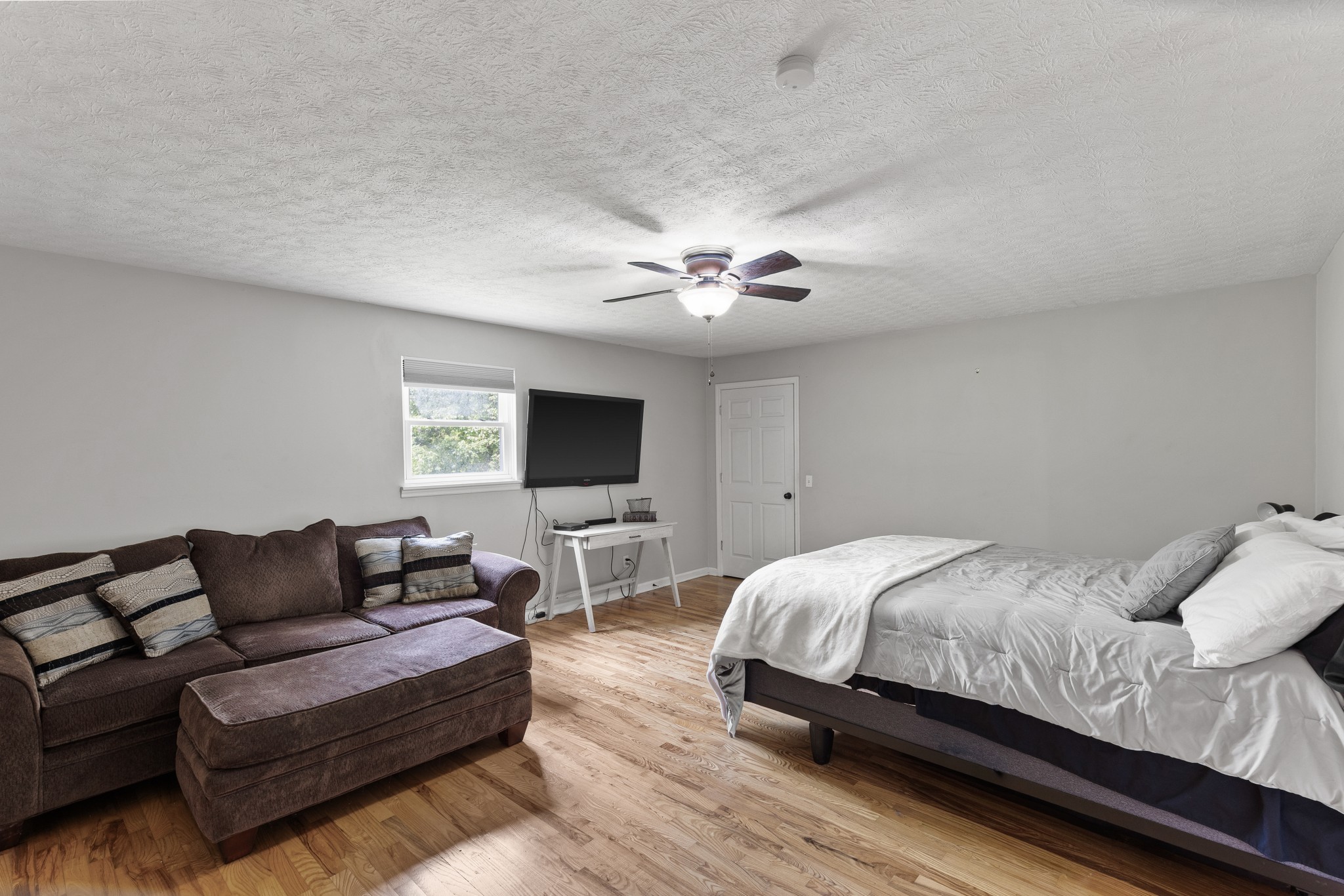 2490 Clampit Hollow Road Lafayette, TN 37083 - Photo 22 of 55 a bedroom with a bed and a couch