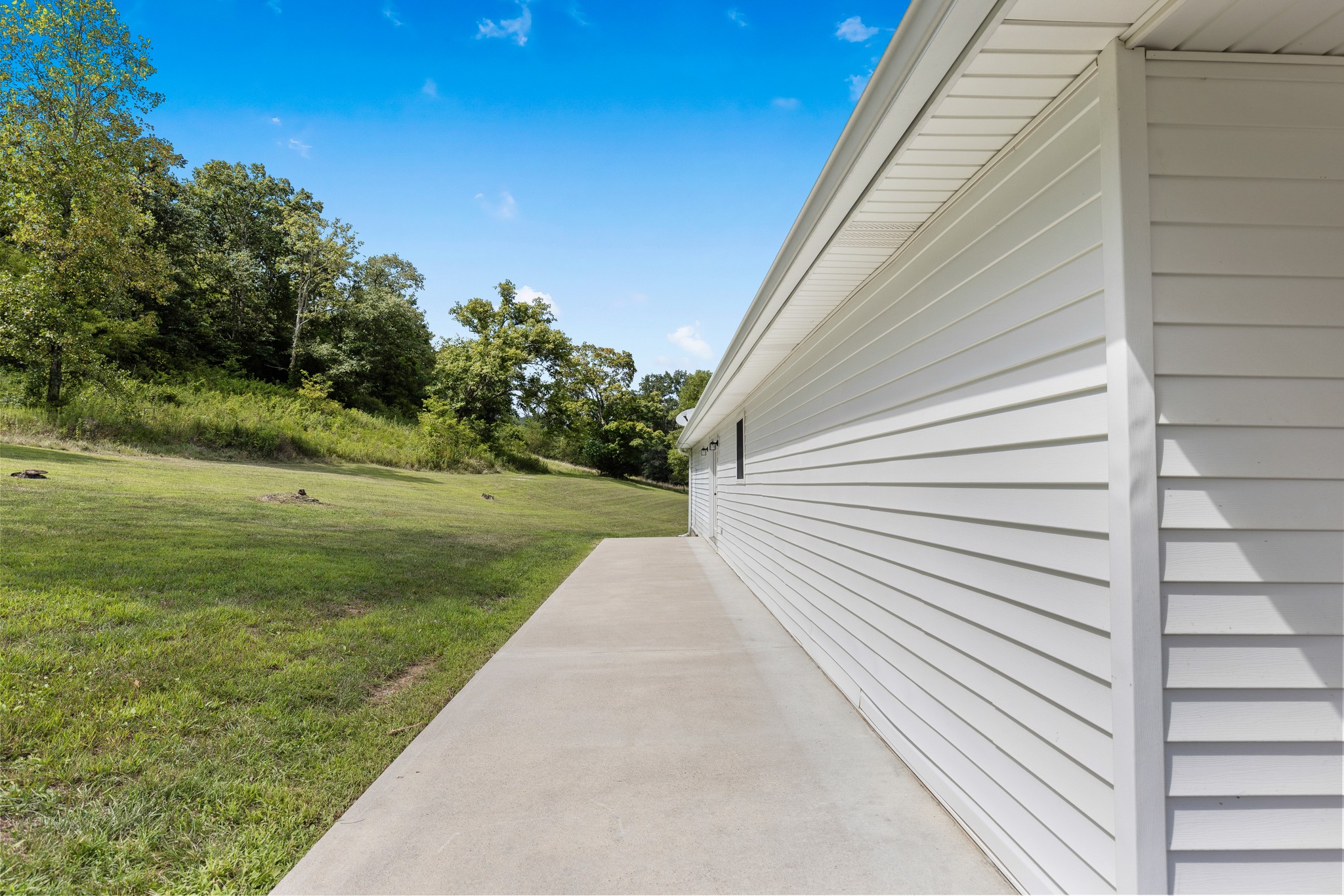 2490 Clampit Hollow Road Lafayette, TN 37083 - Photo 33 of 55 a view of a backyard with an outdoor space