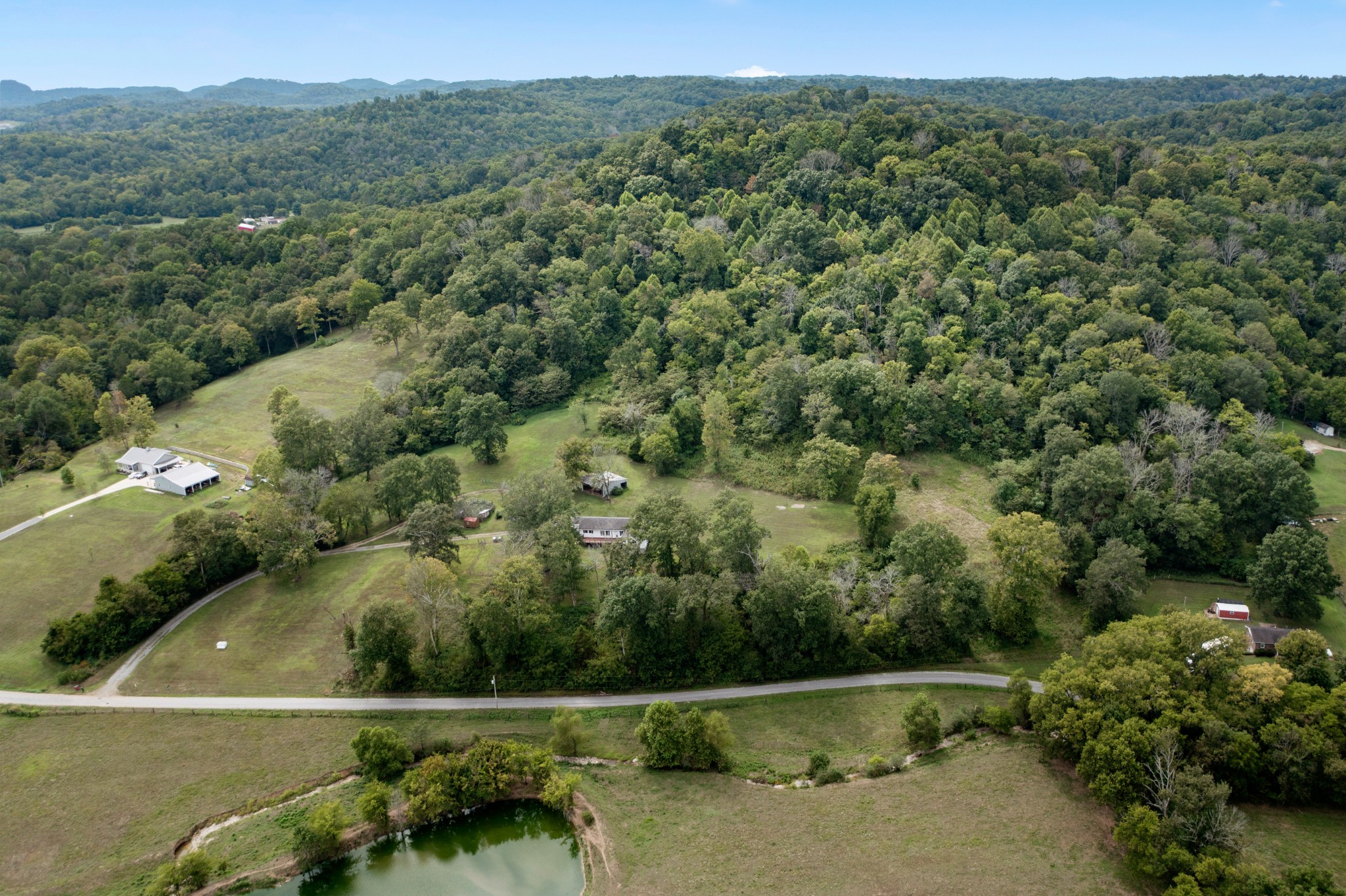 2490 Clampit Hollow Road Lafayette, TN 37083 - Photo 50 of 55 a view of a green field with lots of trees
