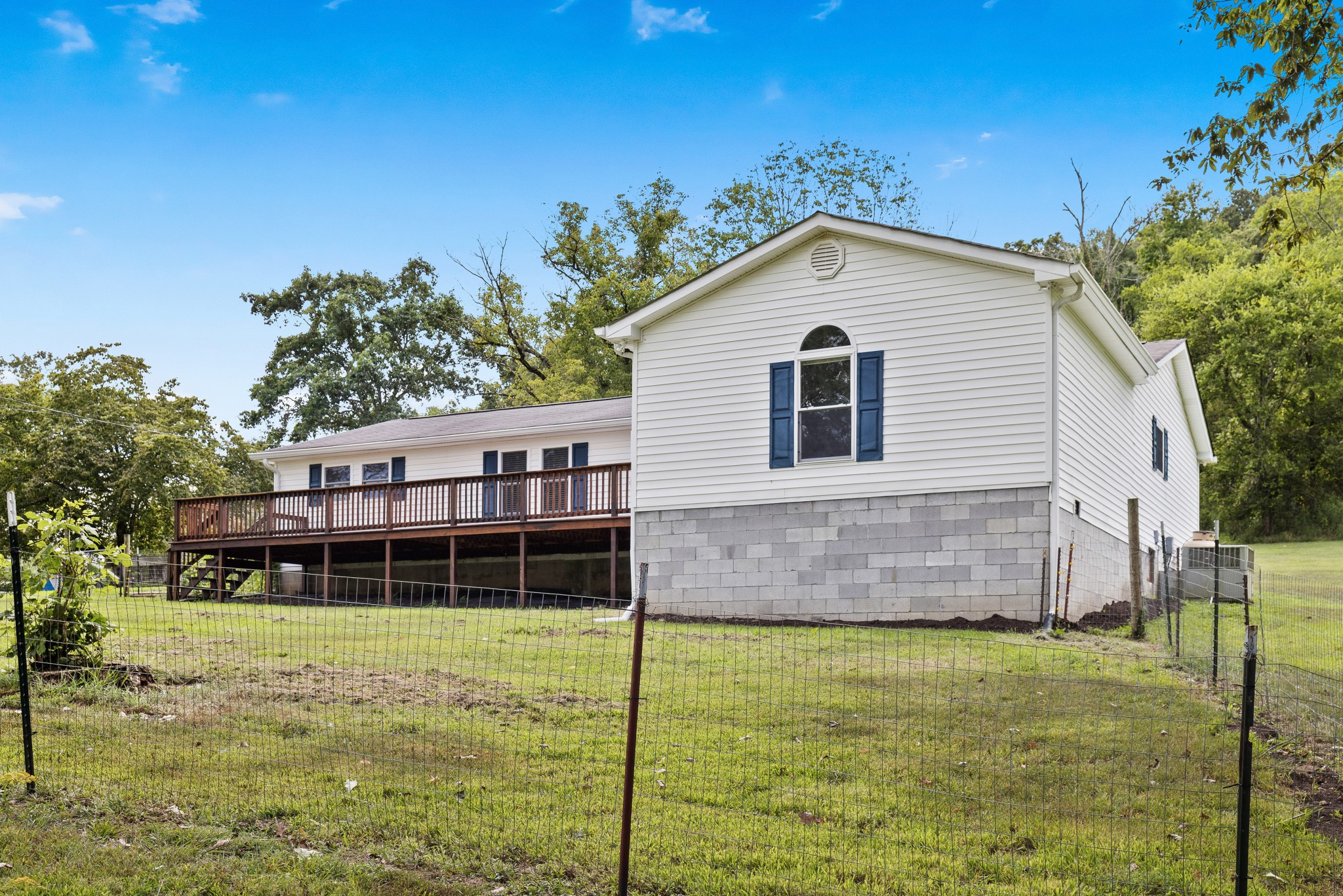 2490 Clampit Hollow Road Lafayette, TN 37083 - Photo 9 of 55 a front view of a house with a yard