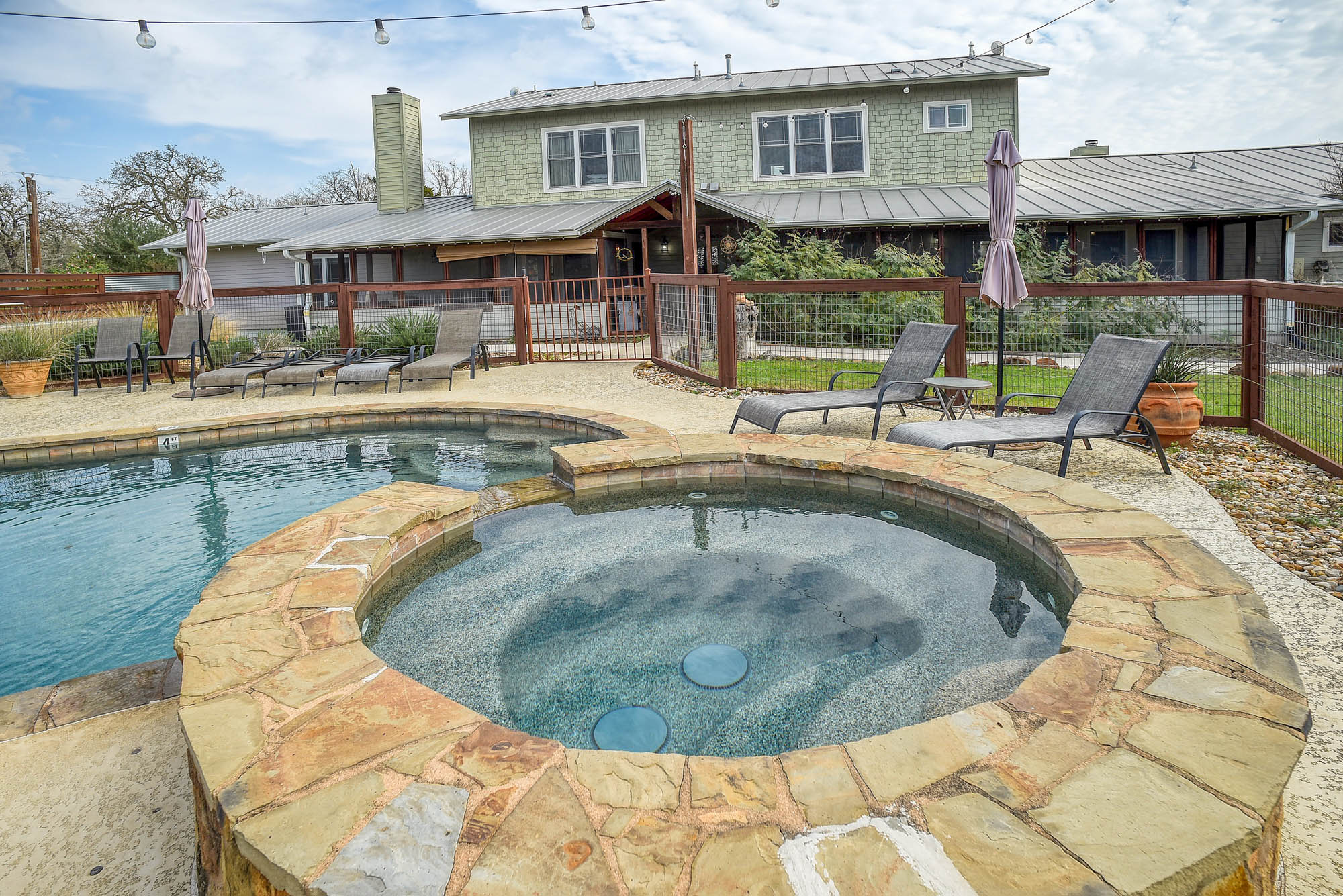 418 Vyvjala Road Smithville, TX 78957 - Photo 33 of 40 View of pool with a patio area and a pool with connected hot tub