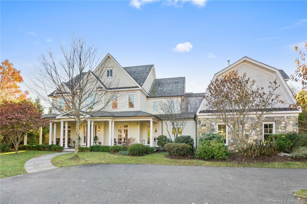 a front view of a building with a garden