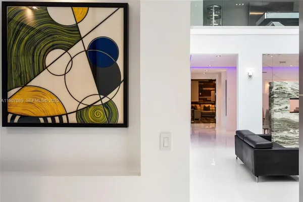 a dining room with furniture and a window