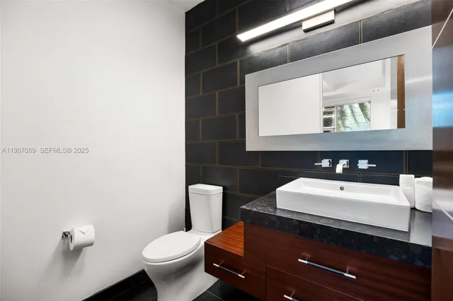 a kitchen with kitchen island a large window in it