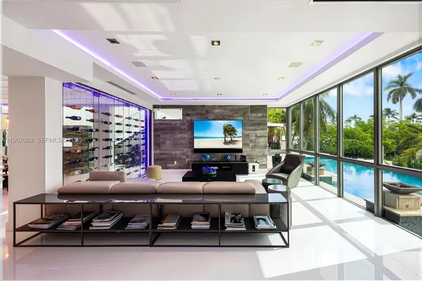 a bedroom with a bed and a television