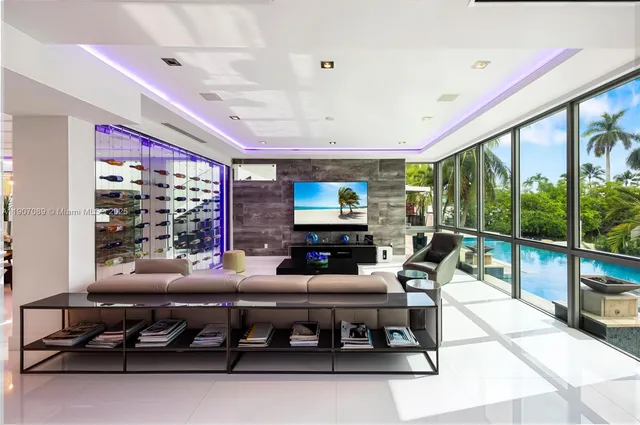 a bathroom with a bathtub a mirror a sink and glass door