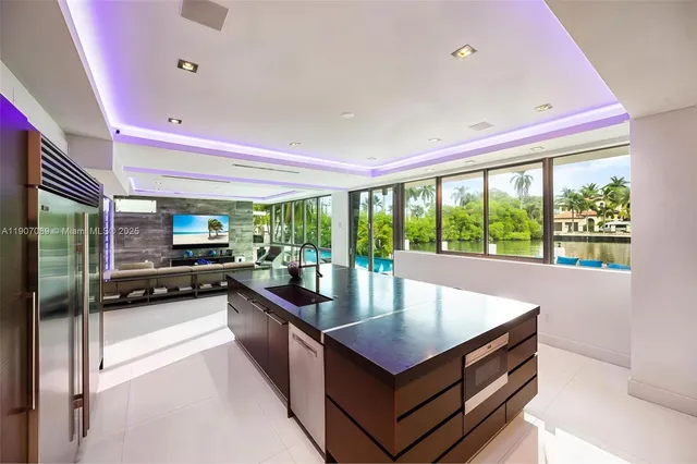 a living room with couch and a large window