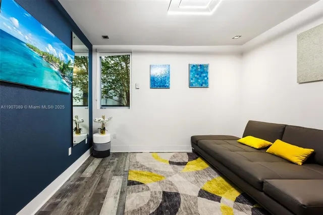 a room with furniture pool table and windows