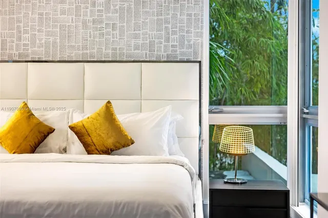 a bathroom with a double vanity sink and a large mirror
