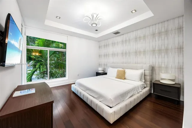 an aerial view of a houses with a lake view