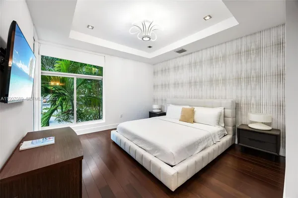 a view of a lake with a house in the background