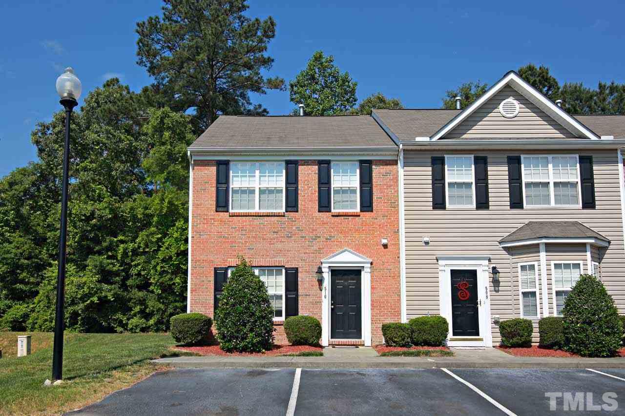 510 Huron Road Raleigh, NC 27610 - Photo 1 of 13 a front view of a house with a yard and trees