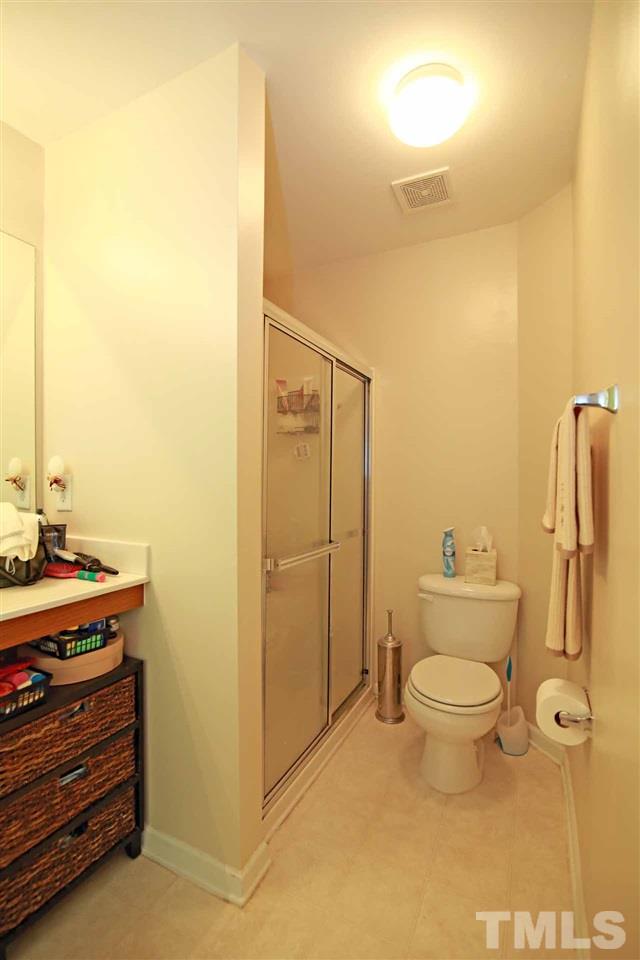 510 Huron Road Raleigh, NC 27610 - Photo 8 of 13 a bathroom with a granite countertop toilet and a sink