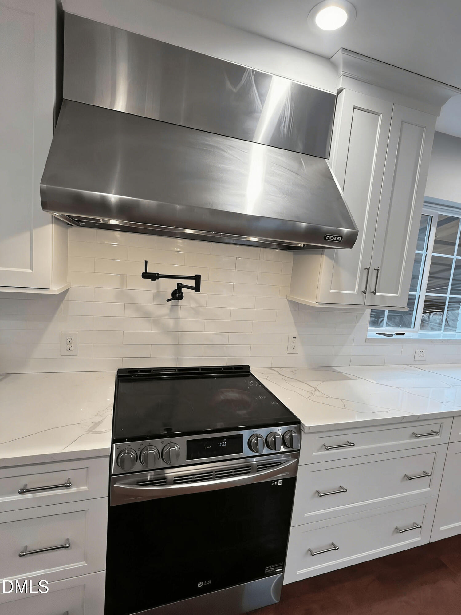 409 Rockingham Street Carthage, NC 28327 - Photo 13 of 56 a stove top oven sitting inside of a kitchen