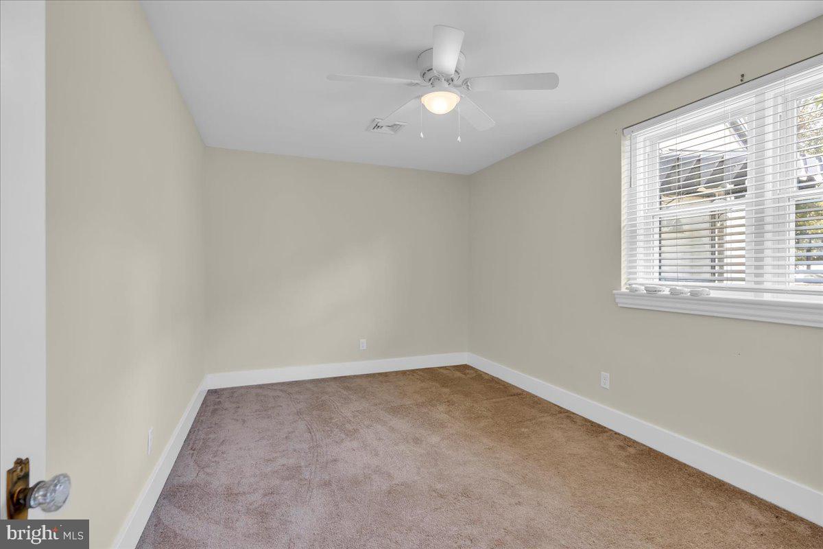 217 South Main Street Elmer, NJ 08318 - Photo 14 of 25 an empty room with a window