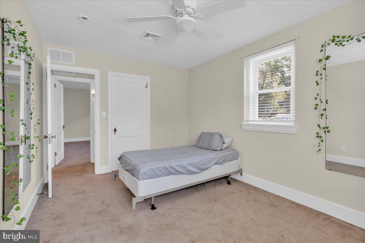 217 South Main Street Elmer, NJ 08318 - Photo 15 of 25 a spacious bedroom with a bed and a window